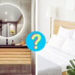a hotel room bathroom and guest room with a question mark