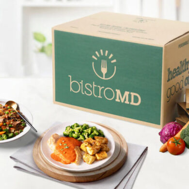 bistroMD meal deliver box with prepared plates and healthy, fresh veggies on a kitchen counter