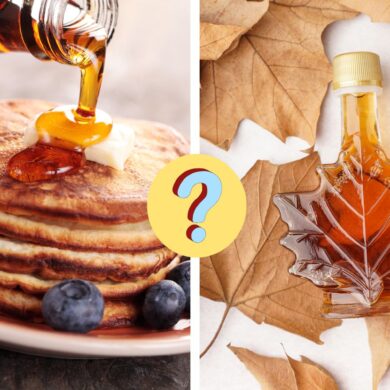 maple syrup poured on pancakes next to a leaf shaped jar of maple syrup