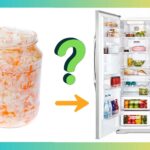 a jar of sauerkraut next to a open refrigerator
