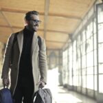 Man in Brown jacket Carrying Bag Smiling