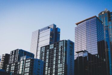 a skyline of high rise buildings at dusk