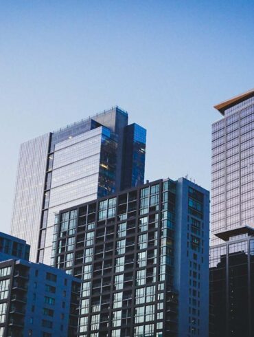 a skyline of high rise buildings at dusk