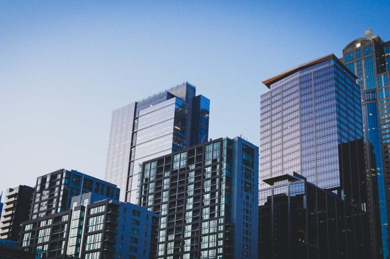 a skyline of high rise buildings at dusk