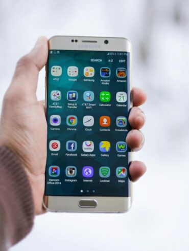 Person Holding Silver Android Smartphone