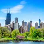 Chicago, IL, United States in springtime. Green Trees Near the Water in a sunny cityscape