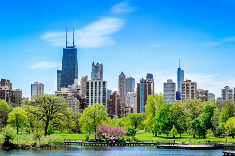 Chicago, IL, United States in springtime. Green Trees Near the Water in a sunny cityscape