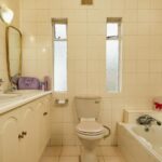 an older home bathroom in need of update and repair