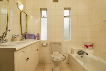 an older home bathroom in need of update and repair