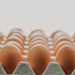 up close large container of chicken eggs in the fridge