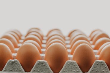 up close large container of chicken eggs in the fridge