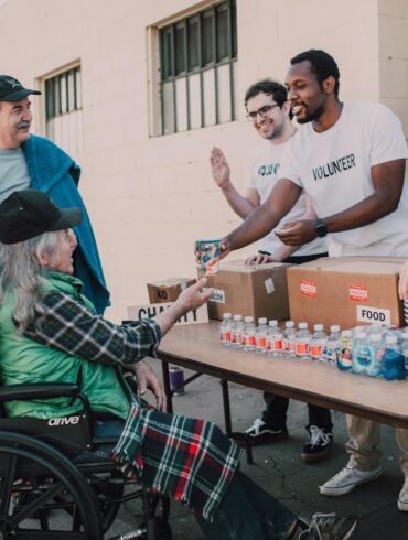 a group of people volunteering to help the less fortunate