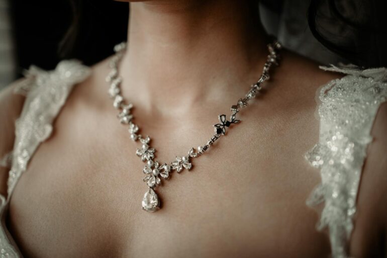 a woman wearing an elegant diamond necklace