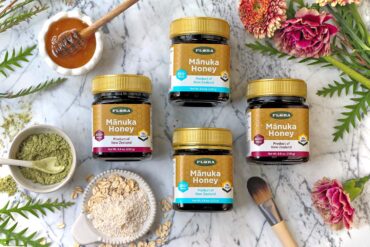 a selection of 4 manuka honey containers with different ratings