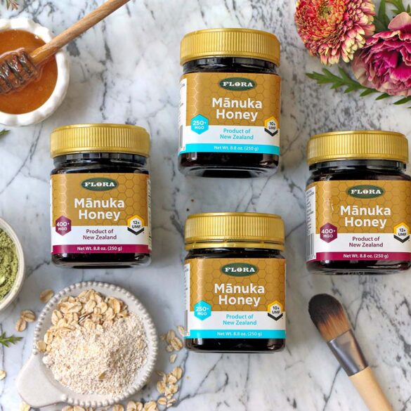 a selection of 4 manuka honey containers with different ratings