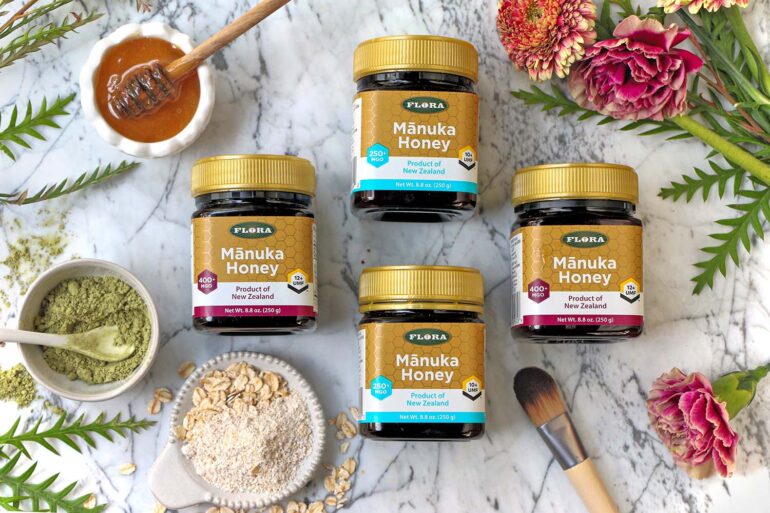a selection of 4 manuka honey containers with different ratings