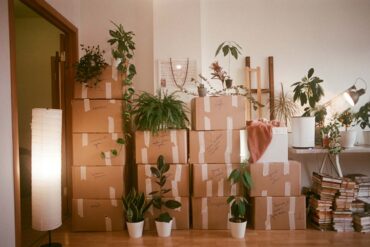 moving boxes stacked in a living room and ready to move