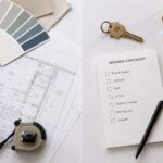 Split scene flat lay left side showing architectural renovation blueprints, paint swatches, and a small tape measure, right side showing a house key, a folded map, and a moving checklist