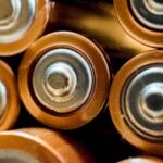a closeup shot of the tops of aa and aaa batteries