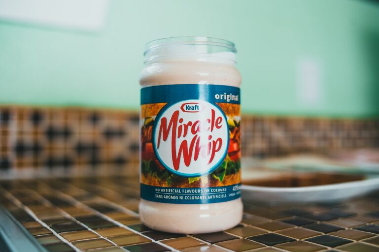 an open jar of miracle whip on a tiled counter