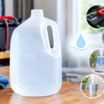 a jug of distilled water on a table with a graphic of uses - iron, drinking, battery, humidifier