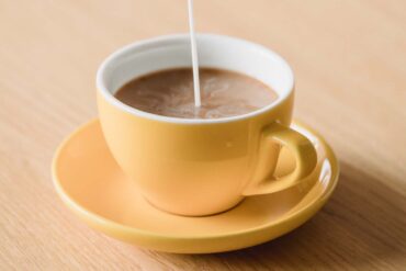 Coffee-Mate being poured into a fresh cup of coffee