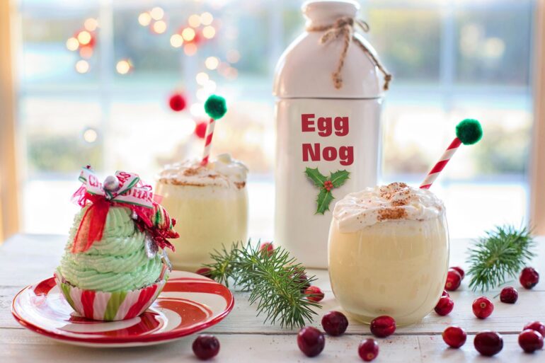 Charming Christmas display with eggnog and festive cupcake on a table