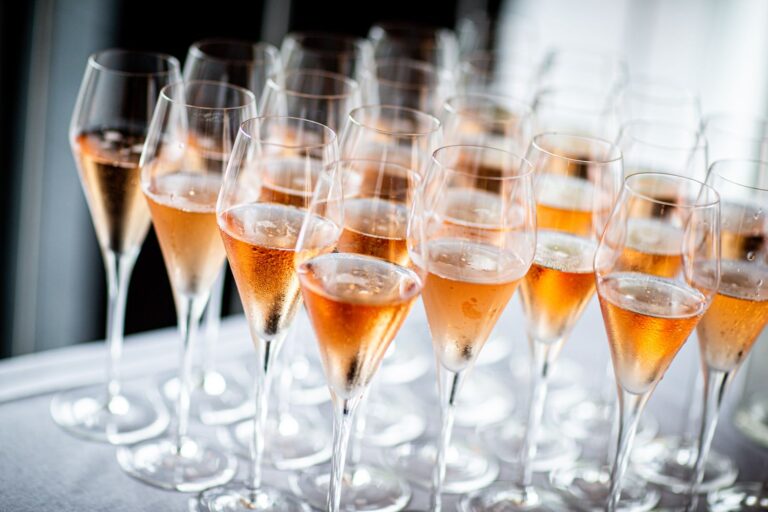 an event table full of glass flutes with prosecco