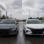Two sedans side by side: a gas-powered car in front of an industrial plant and an electric car beside wind turbines, solar panels, and a charging station