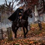 A realistic depiction of the Headless Horseman riding a black horse through a historic, autumn cemetery. He wears a dark cloak with a yellow-lined collar where his head should be. The path is covered in fallen orange and brown leaves, surrounded by old, weathered tombstones and bare trees under a moody, overcast sky.